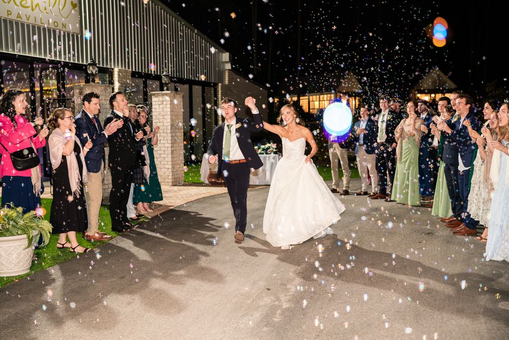 Guests lining the path for a confetti send-off after dark